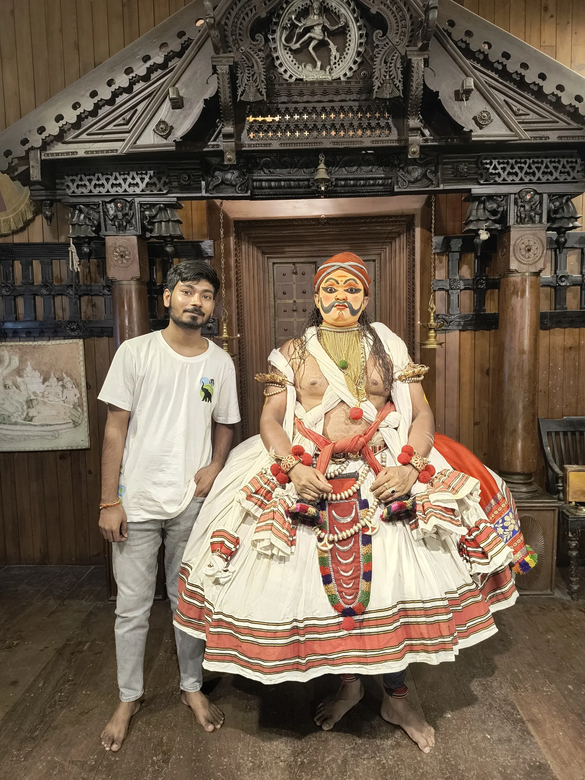 a man standing next to a man in a garment